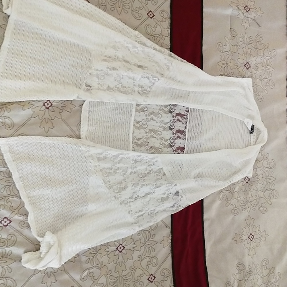 Lacy sleeveless cardigan